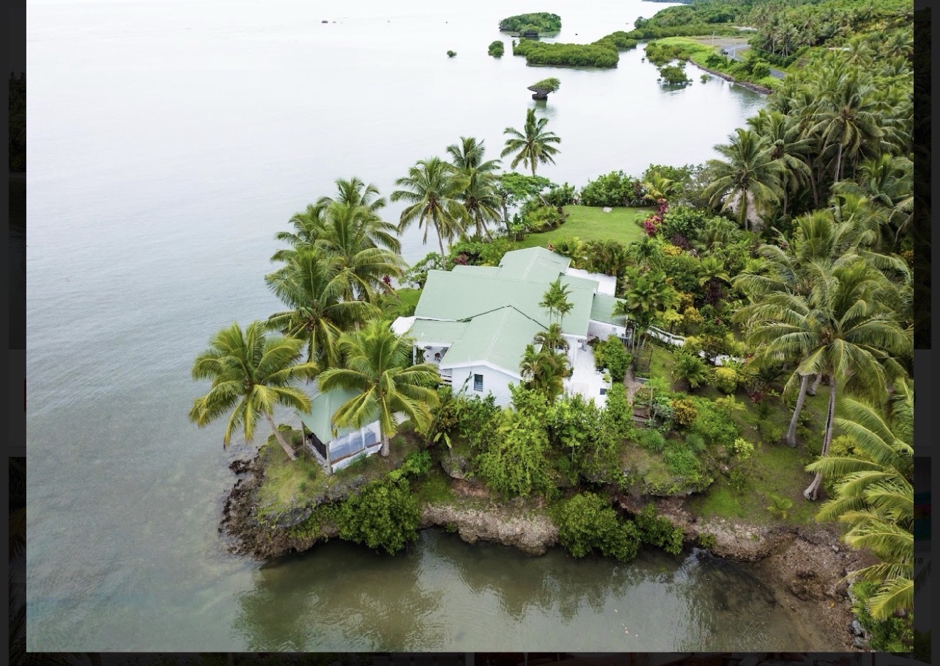 Aerial view of Namawa Private Estate surrounded by sea and tropical gardens