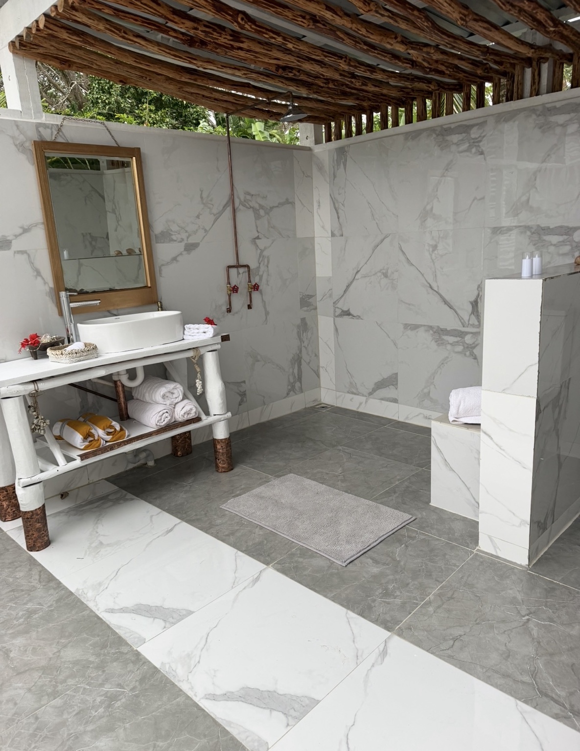 Private open-air tropical bathroom at Namawa