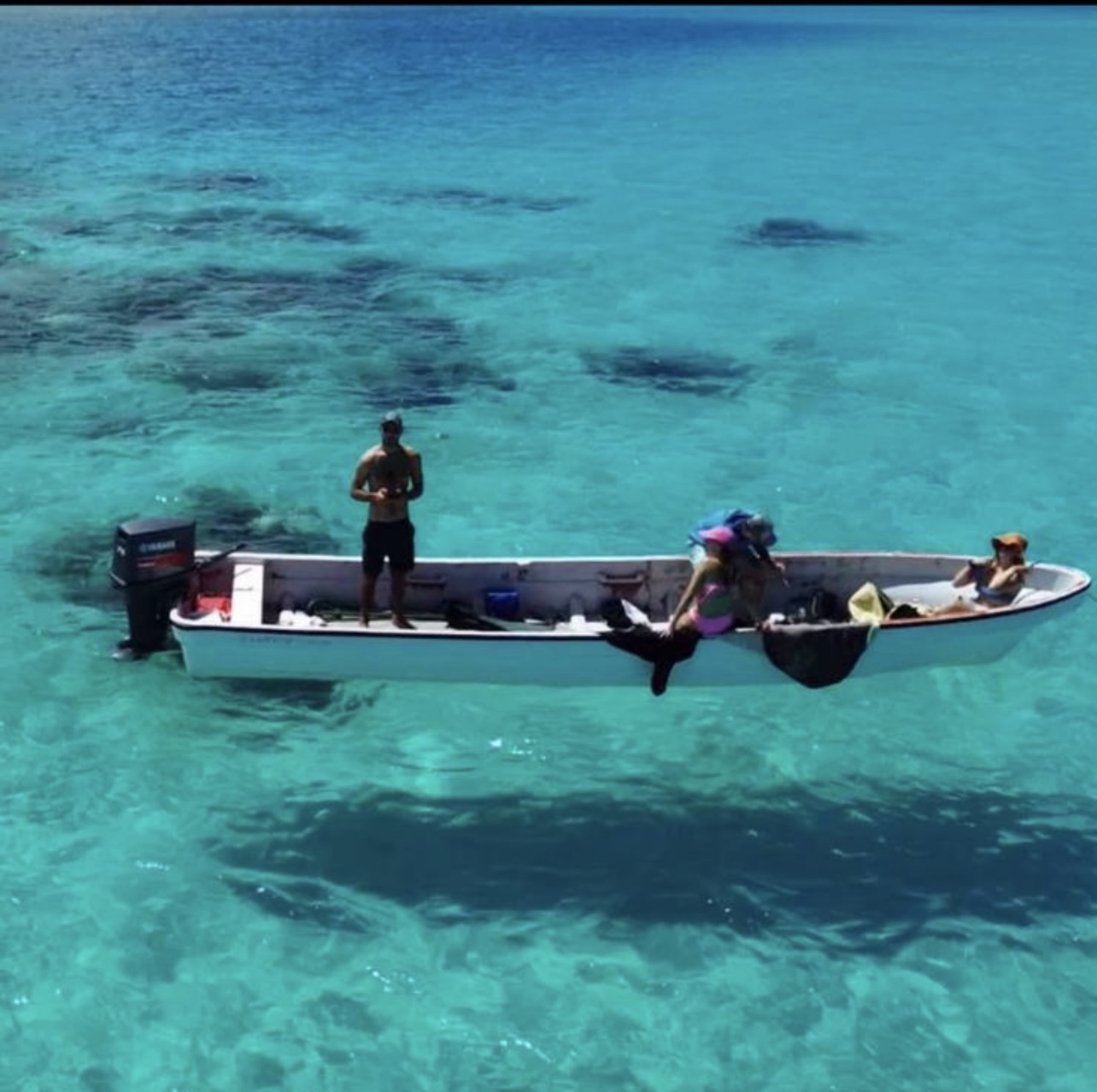 A local boat in the clear waters near Namawa